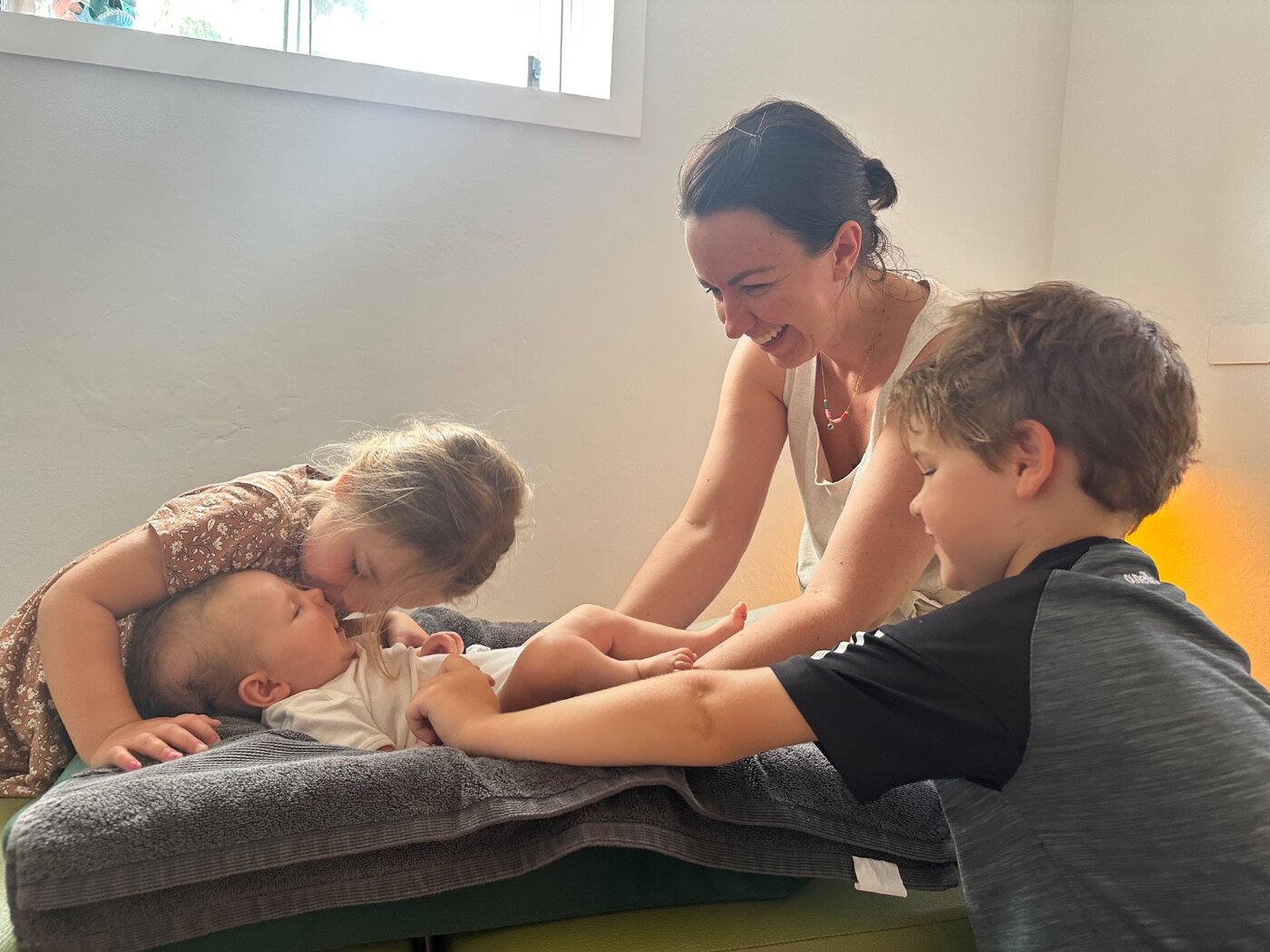 Dr Felicity Young with a family and newborn at the clinic